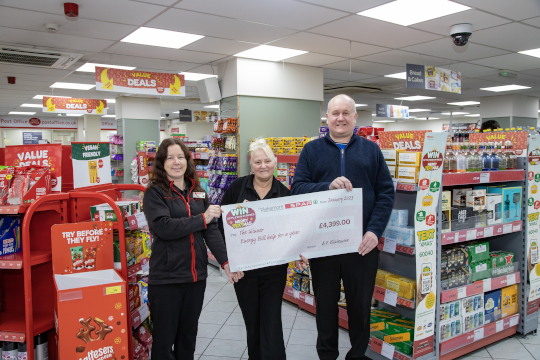 Jonathan Whitwell collecting his prize from Store Manager Zowie Spragg at SPAR Warndon